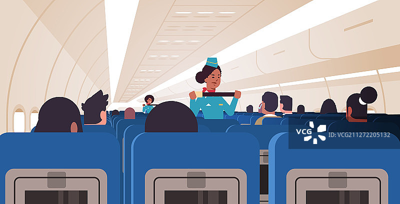 空姐向乘客讲解如何使用座位图片素材