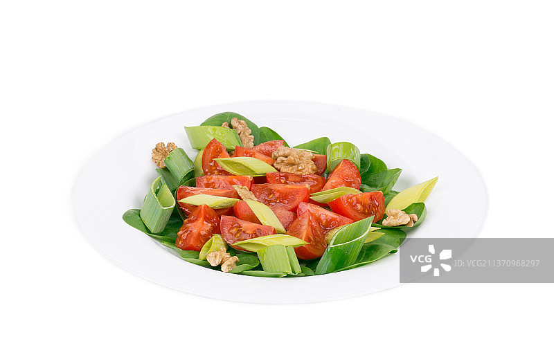 健康的沙拉，在白色背景的盘子里的沙拉的特写图片素材