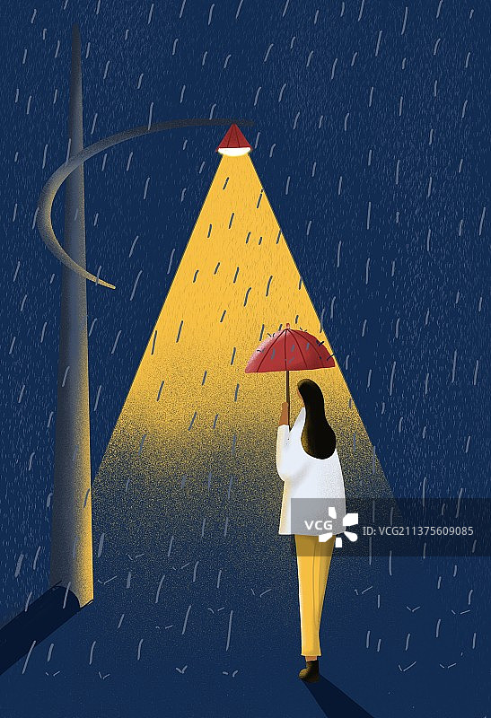 一个人撑着伞在雨中的路灯下走过图片素材