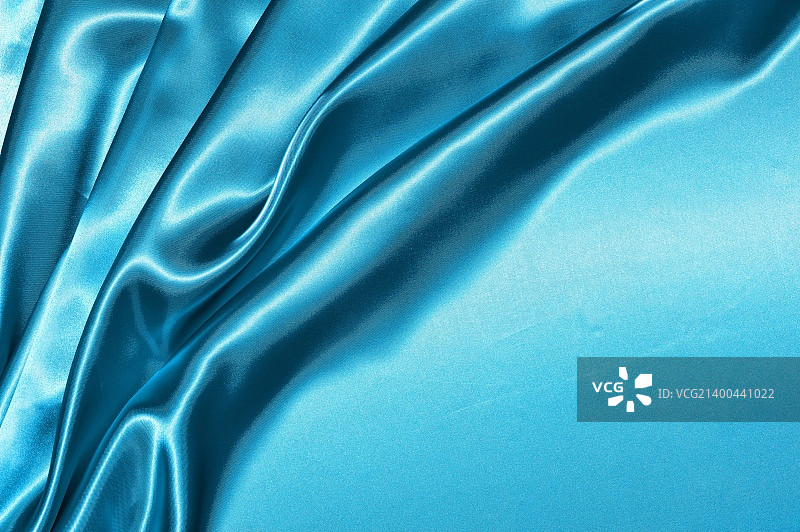 美丽的折叠蓝色丝绸背景图片素材