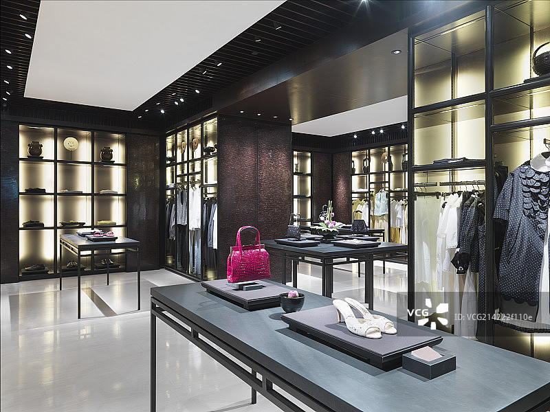 Interior of fashion boutique with purse,shoes and clothes on display图片素材