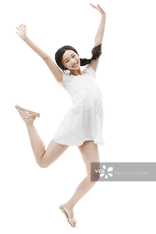 快乐的年轻女子跳跃图片素材