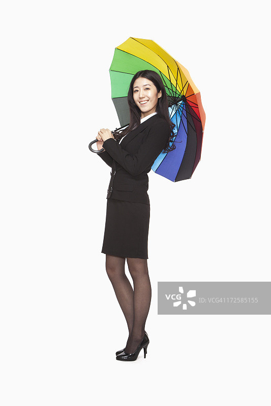 带着彩色雨伞的女商人图片素材