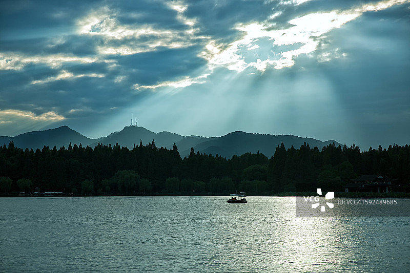 西湖剪影船风景图片素材