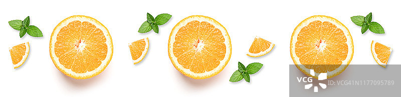 新鲜的橙子，柑橘类水果片与薄荷叶孤立在白色背景。图片素材