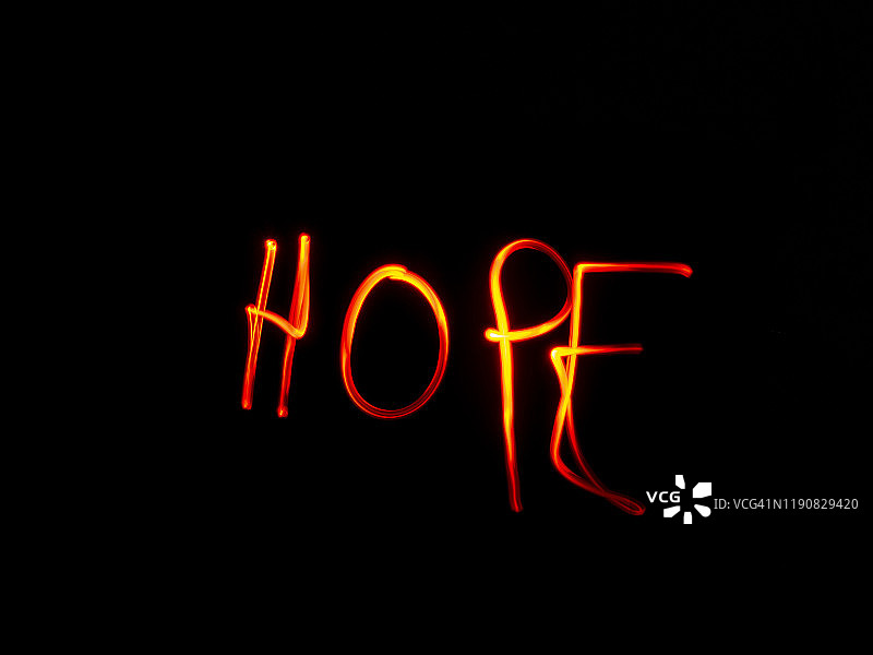 “希望”用红光写在黑色的背景上图片素材