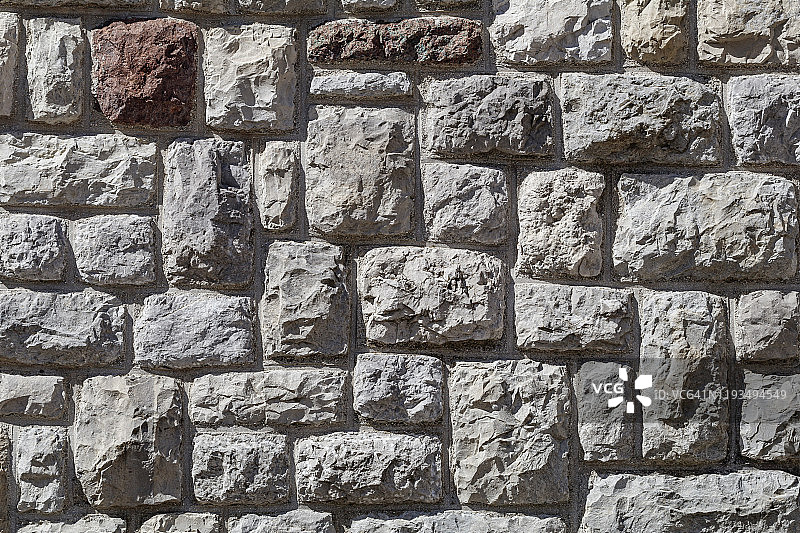 由方形切割的石头制成的石壁图片素材