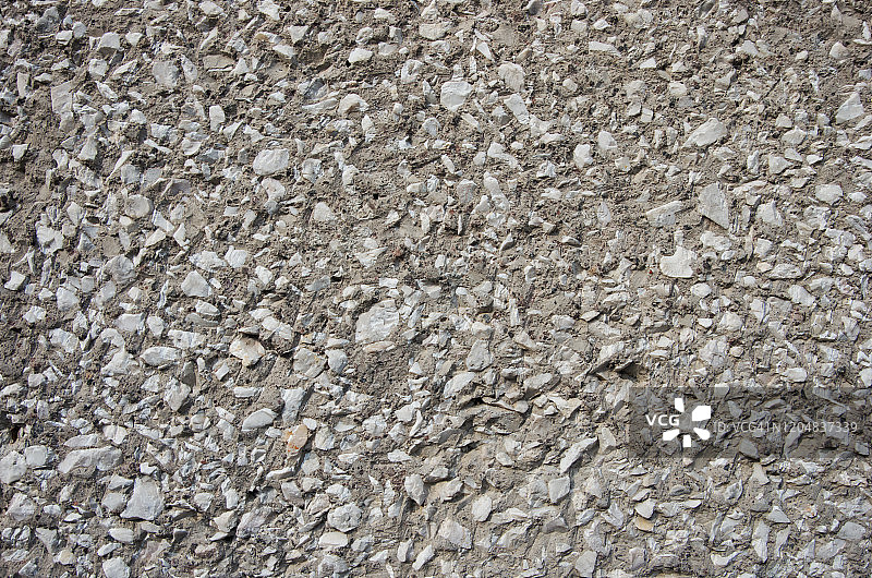 粗糙的卵石混凝土墙由暴露的骨料卵石和水泥图片素材