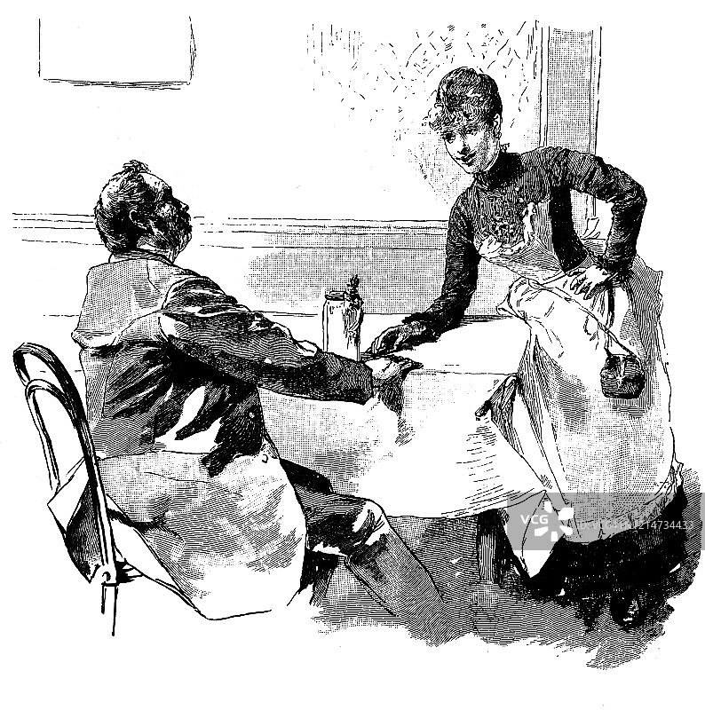 女服务员和一位老人谈话图片素材
