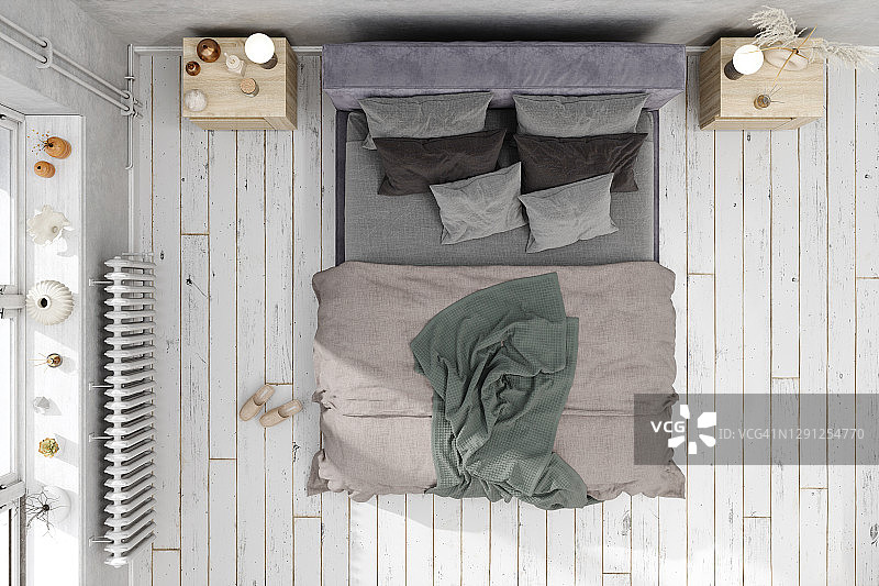 斯堪的纳维亚风格的卧室与凌乱的床俯视图。图片素材