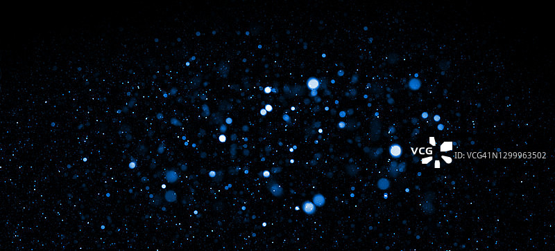 蓝色散焦光和粒子抽象背景图片素材