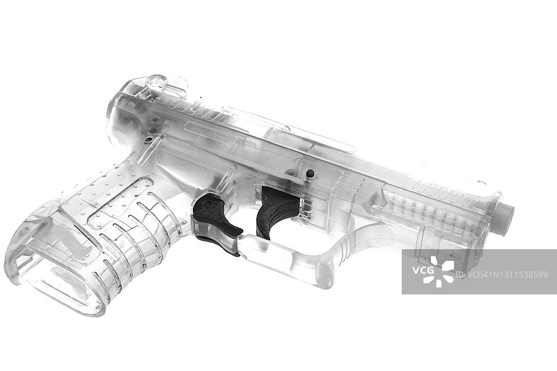 白色背景上的塑料手枪图片素材