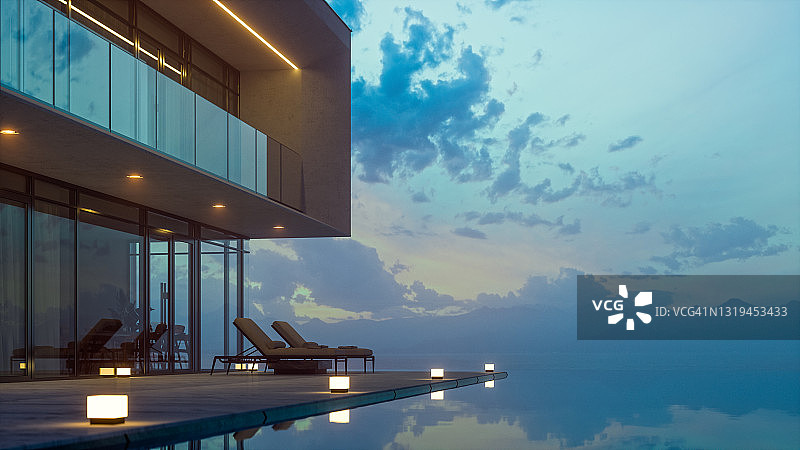 现代豪华别墅与私人无限游泳池在黄昏图片素材