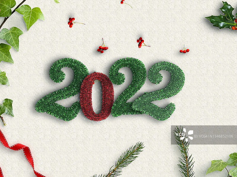 用绿叶制作的2022新年快乐。俯视图图片素材