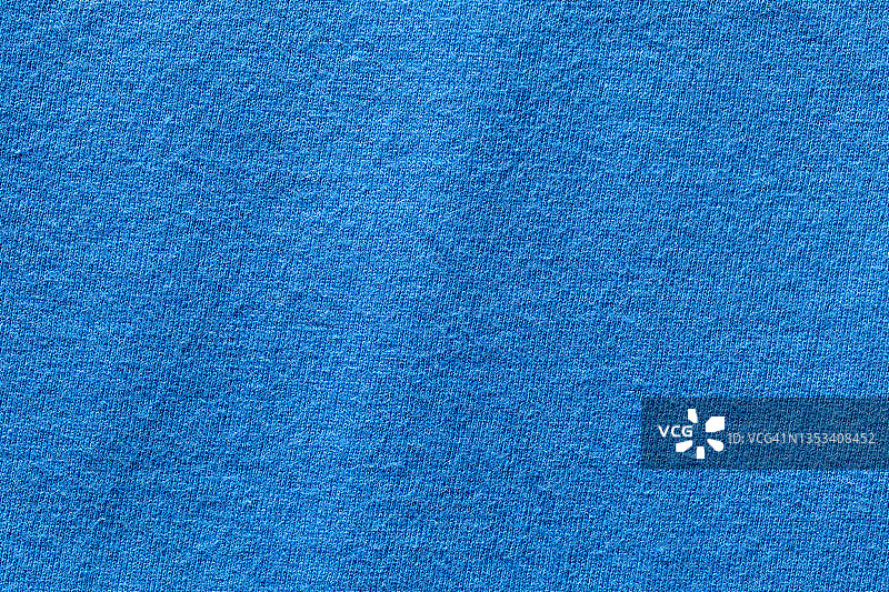 蓝色面料布为聚酯质地和纺织背景。图片素材