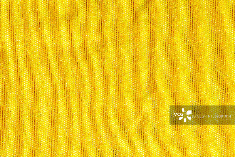 黄色面料，布料涤纶纹理和纺织品背景。图片素材
