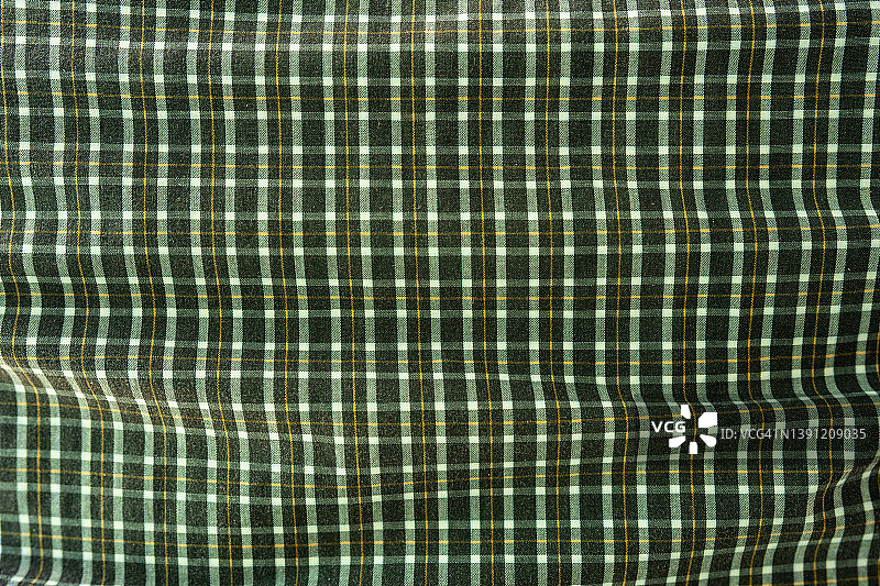 绿色网格面料面料涤纶质感和纺织背景。图片素材