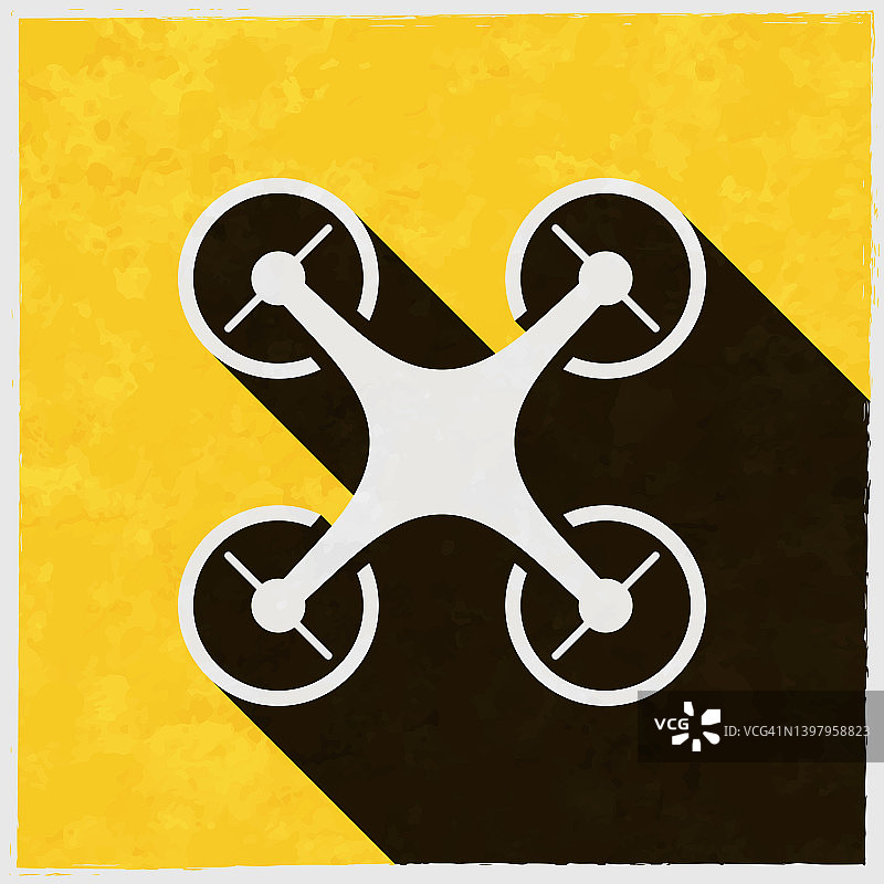 无人机——四轴飞行器。图标与长阴影的纹理黄色背景图片素材