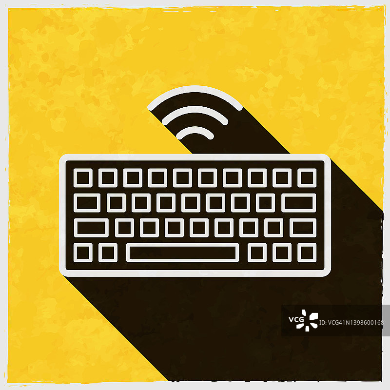 无线键盘。图标与长阴影的纹理黄色背景图片素材
