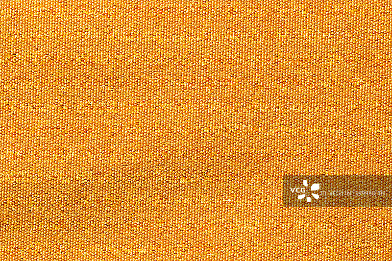 黄色布布涤纶质地和织物背景。图片素材