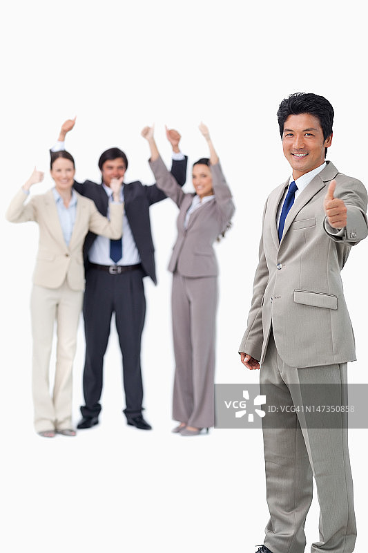 推销员在庆祝时竖起大拇指图片素材