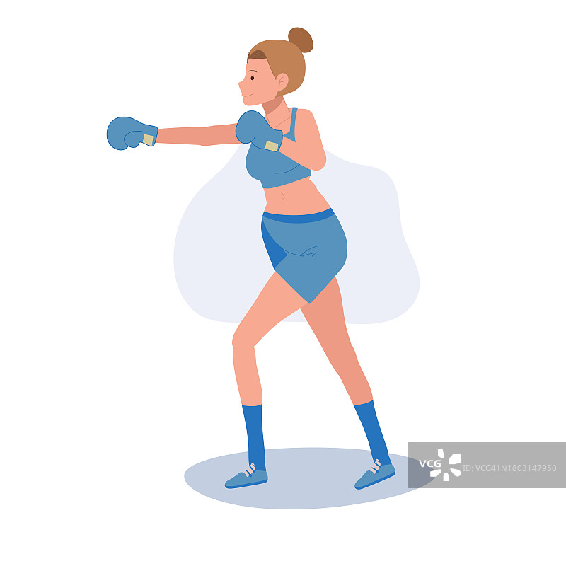 积极的运动女子拳击与信心。强大的女拳击手在健身房锻炼图片素材