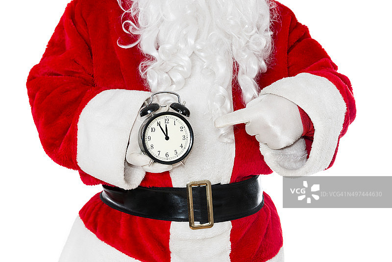 圣诞老人拿着一个显示圣诞时间的闹钟图片素材