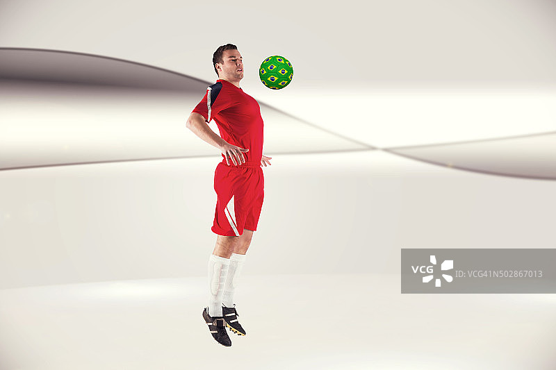 足球运动员在红色跳跃的合成图像图片素材
