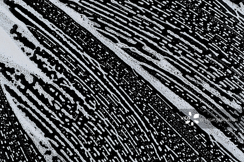 肥皂Sud倾斜模式在黑色的背景图片素材