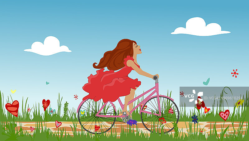 美丽的少女骑着自行车在春花盛开的田野上。图片素材