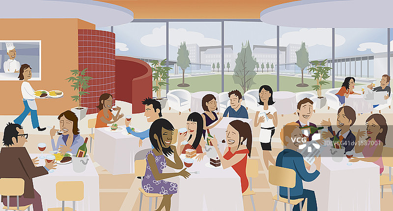 一群人坐在餐厅的桌子旁边吃边聊图片素材