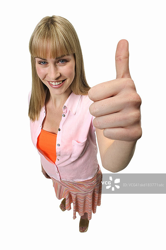 对年轻女性竖起大拇指的高度评价图片素材
