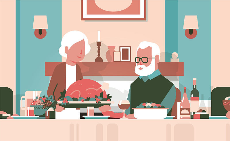 老两口围坐餐桌，感恩节快乐图片下载