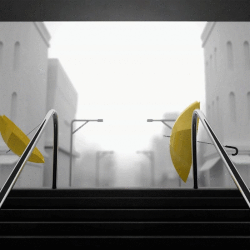 在风中吹着的黄色雨伞图片下载