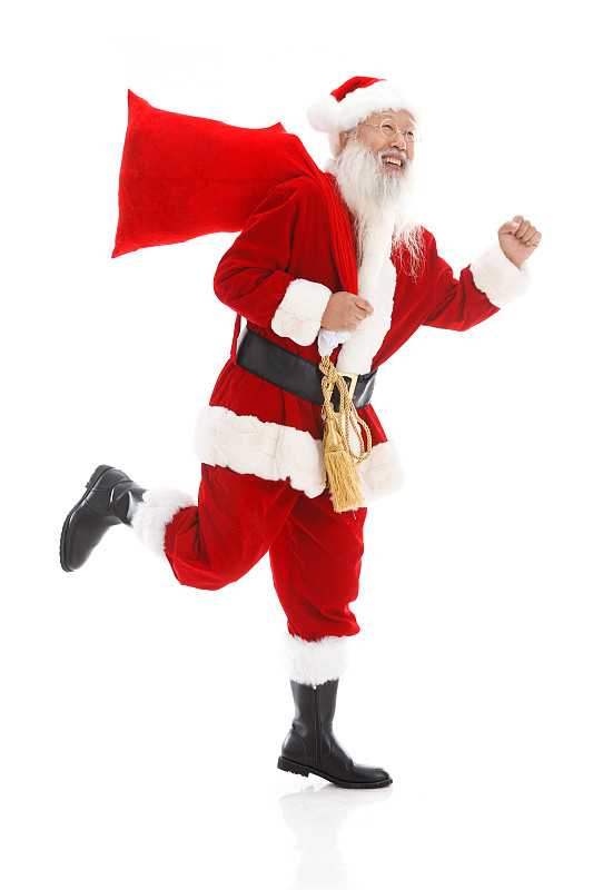 一个圣诞老人背着布袋在奔跑图片下载