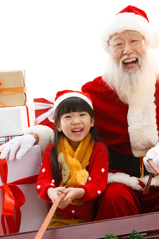 圣诞老人和小女孩在派送圣诞礼物图片素材