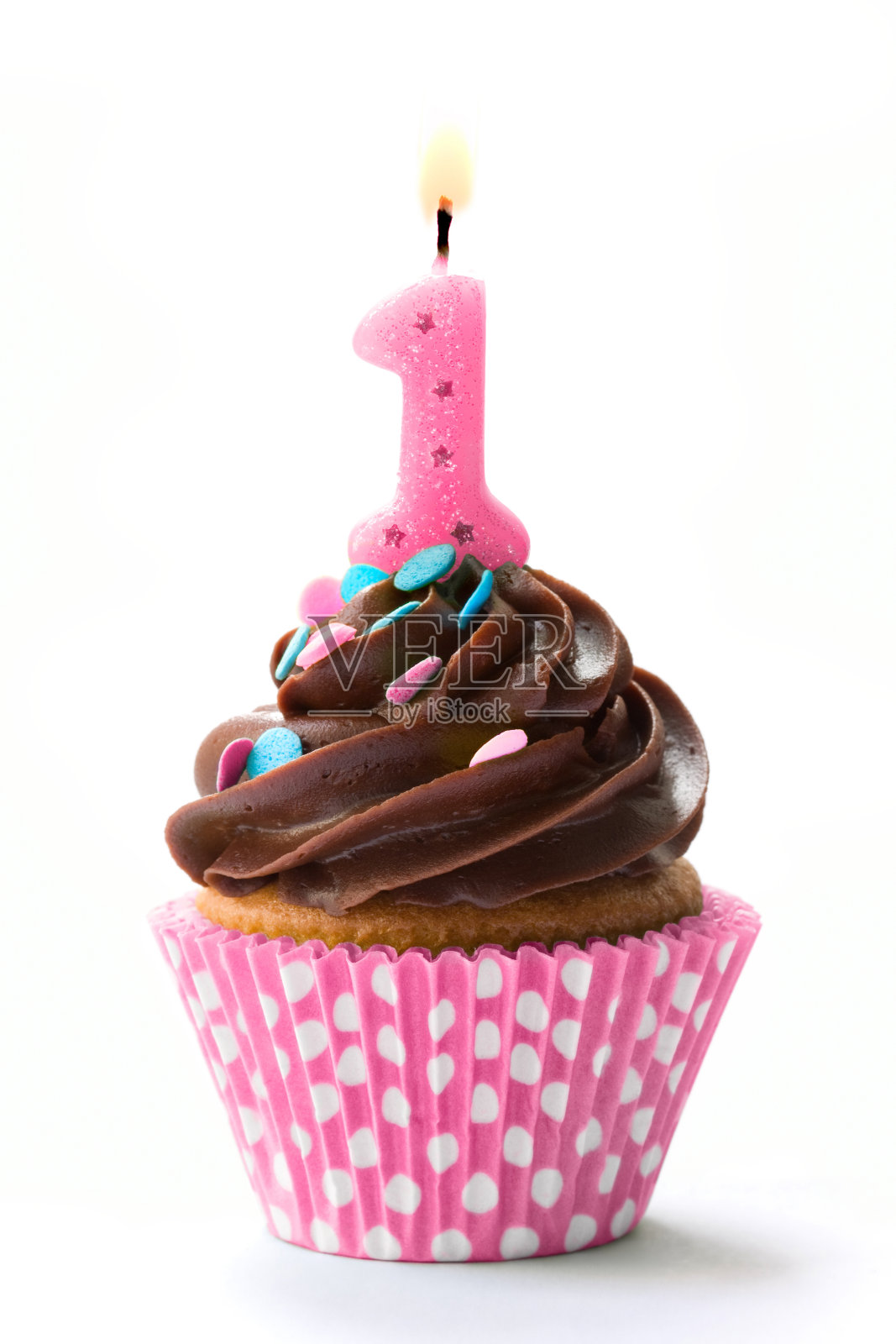 一个有1号和巧克力糖霜的生日纸杯蛋糕照片摄影图片