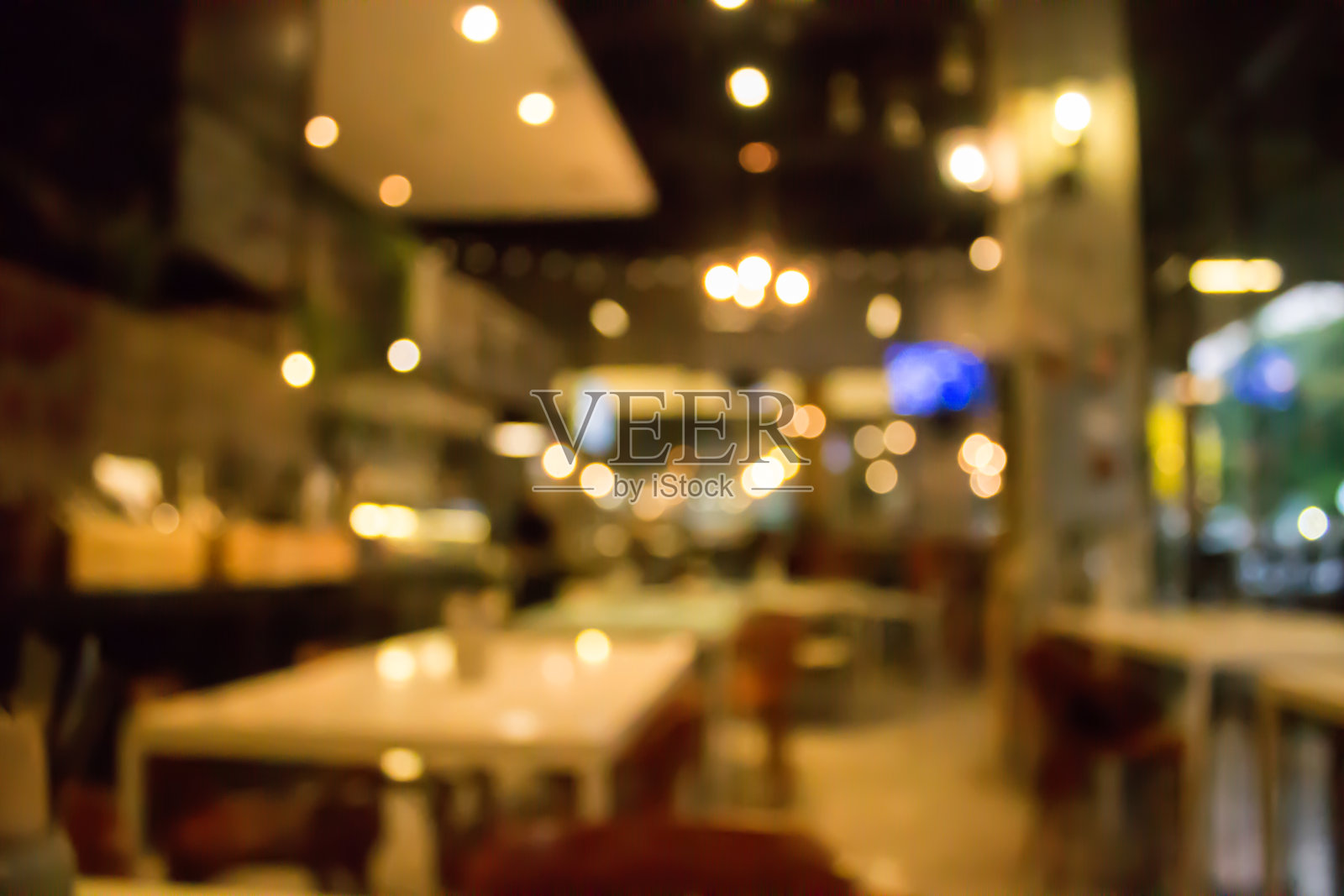 咖啡馆用散景模糊背景。餐厅抽象的散焦。照片摄影图片