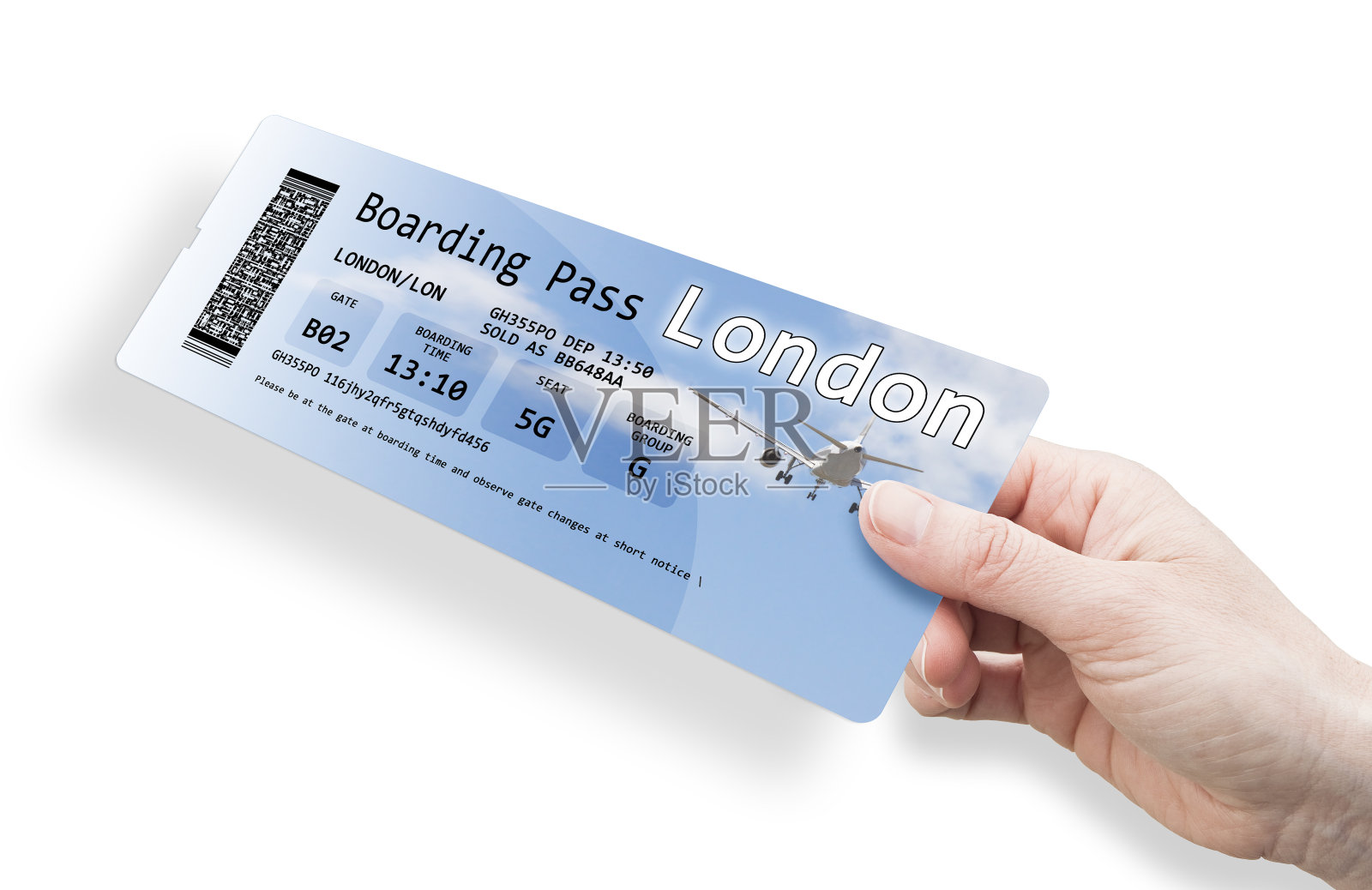 一个女人的手拿着一张去伦敦的机票照片摄影图片