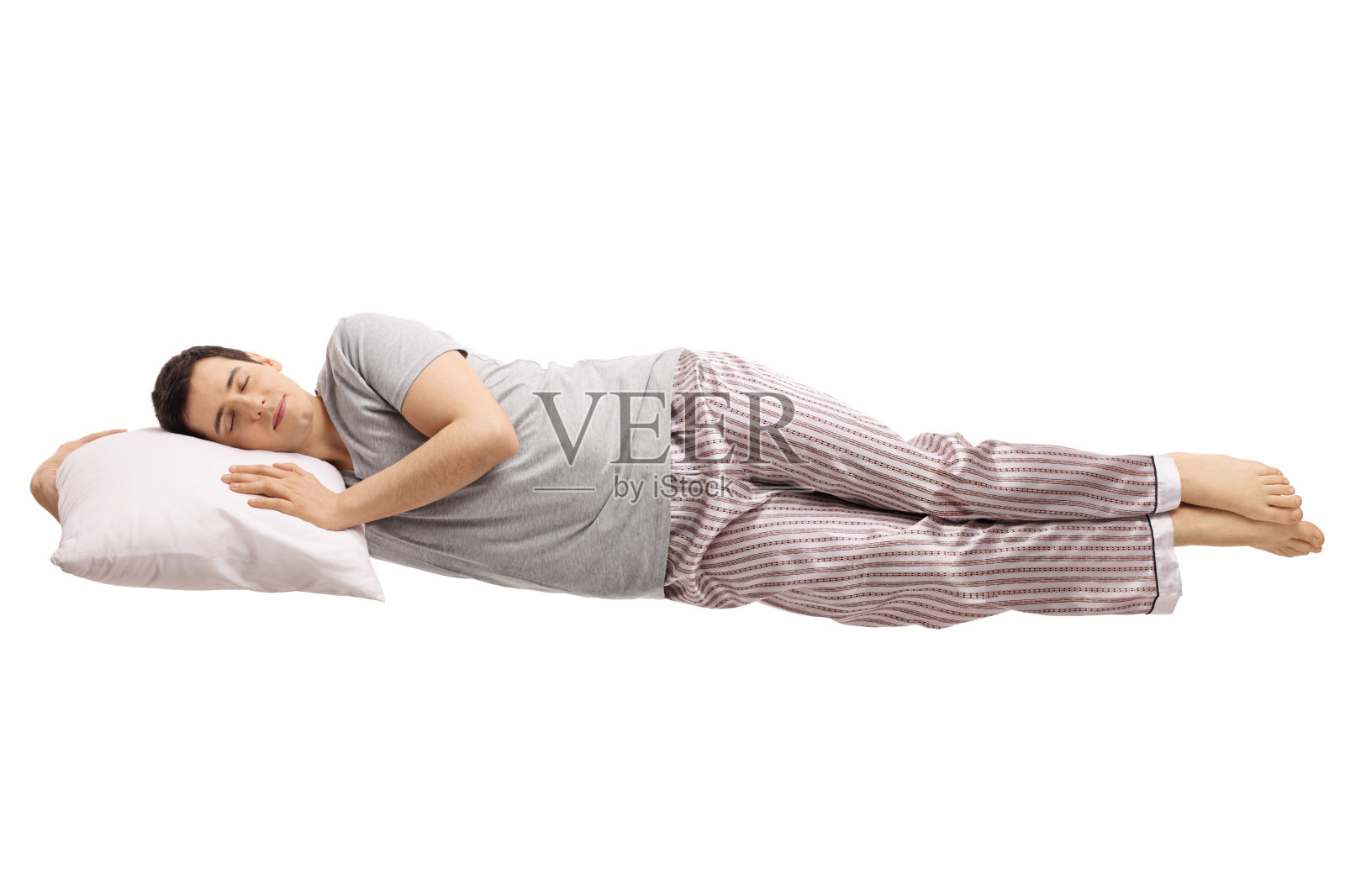一个睡在枕头上，浮在水上的人照片摄影图片