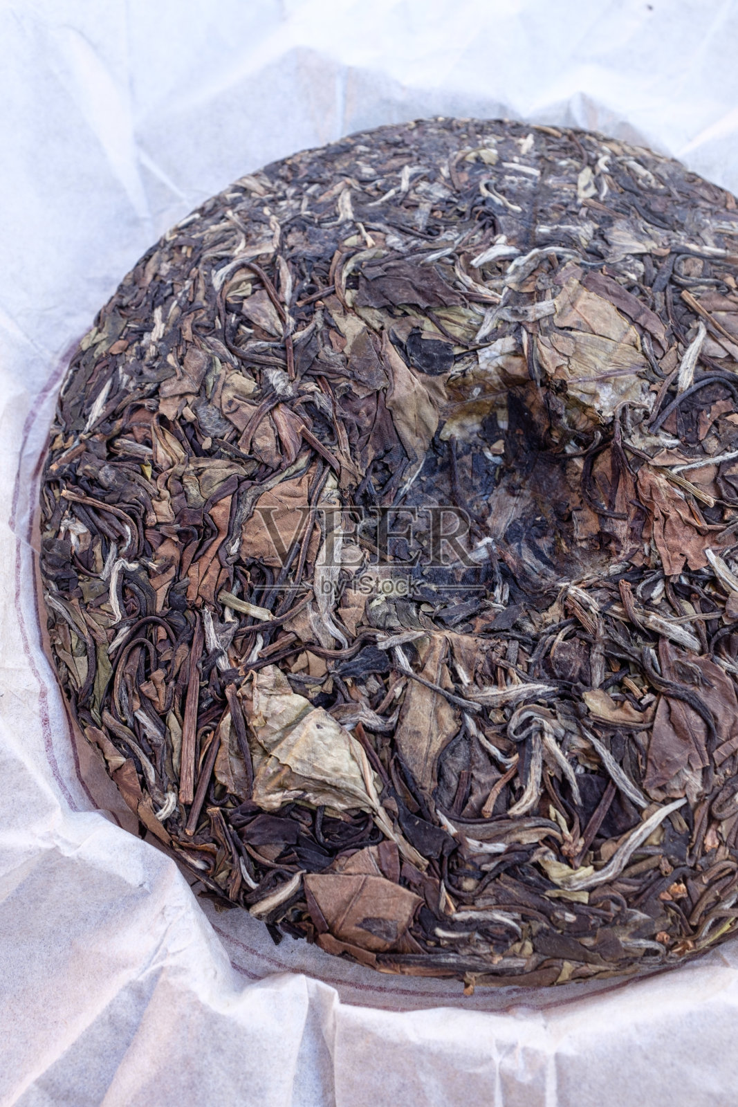 中国寿梅压茶饼。照片摄影图片