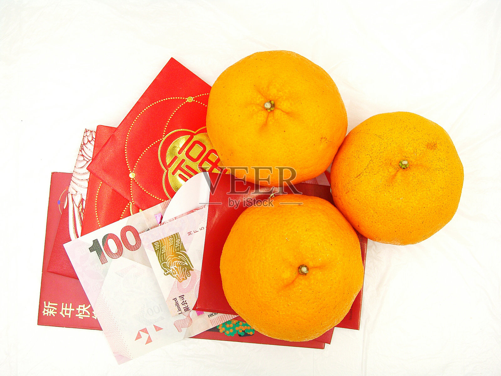 橘子和压岁钱照片摄影图片