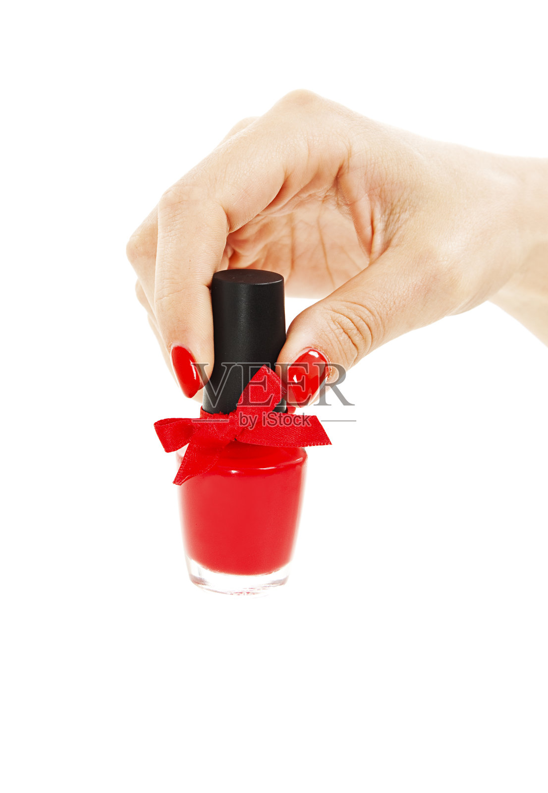 女人的手和一瓶红色指甲油照片摄影图片