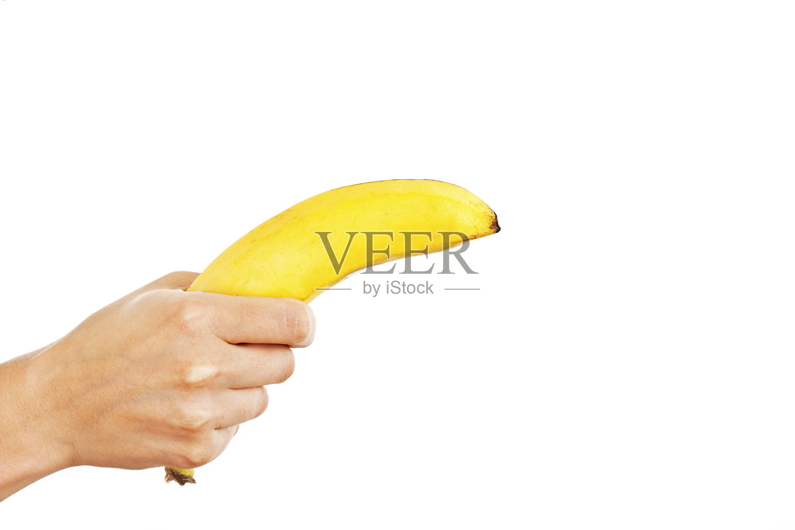 红色指甲的女性手拿着香蕉照片摄影图片