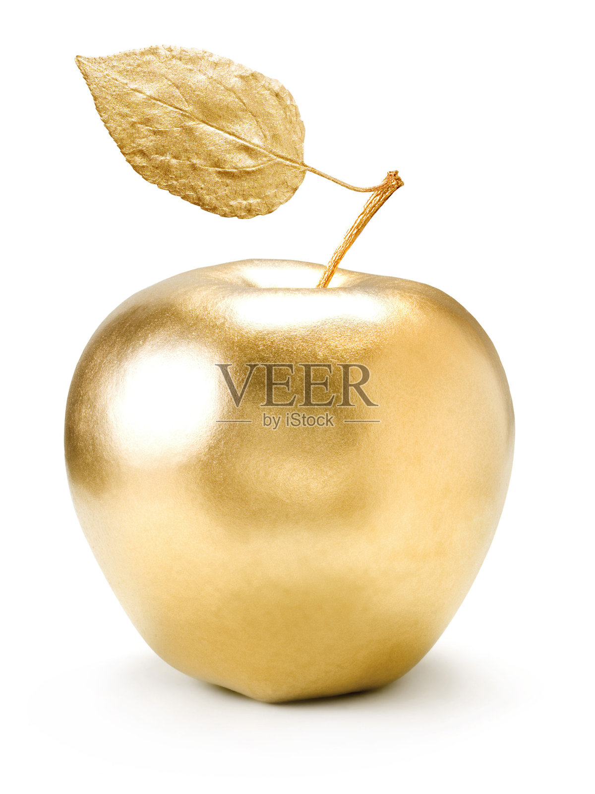 一个金色的苹果，白色的背景上有一片叶子照片摄影图片