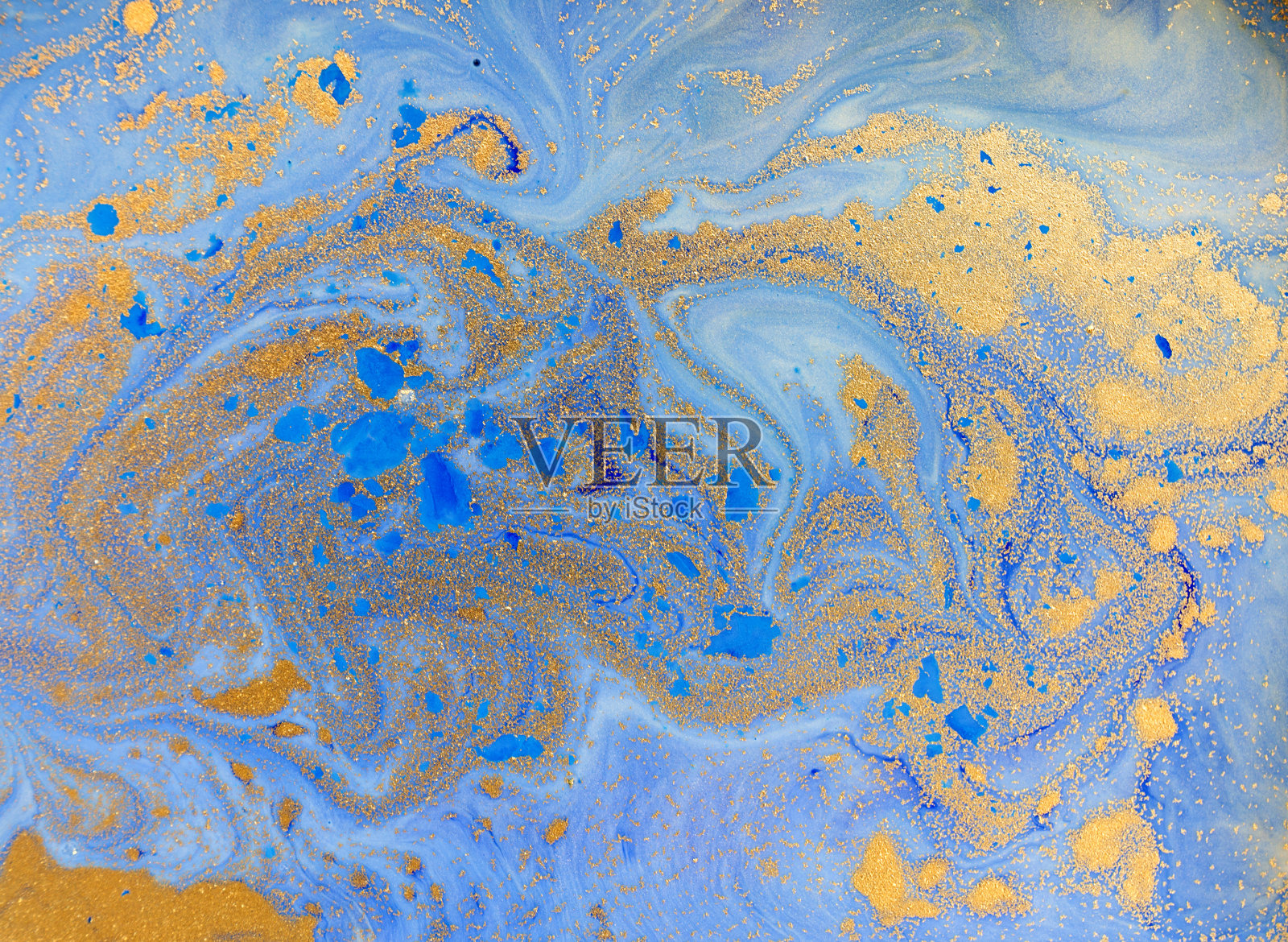 蓝色和金色的液体质地。水彩手绘大理石花纹插图。墨水大理石背景。照片摄影图片