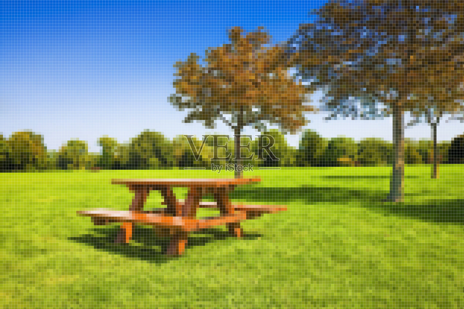 野餐桌上的绿色草地与树木的背景-概念图像像素化效果照片摄影图片