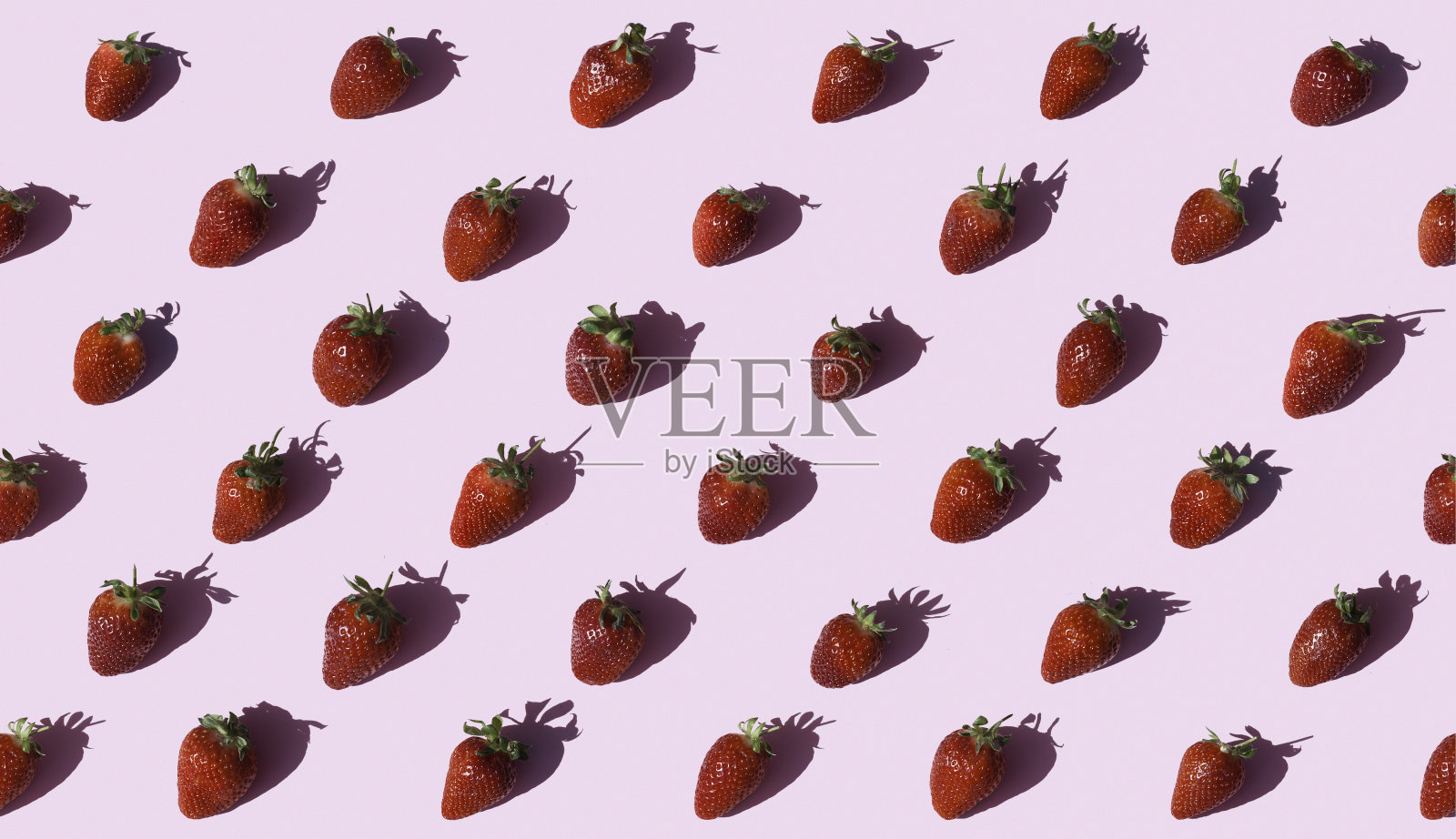 草莓在粉红色的背景无缝照片摄影图片