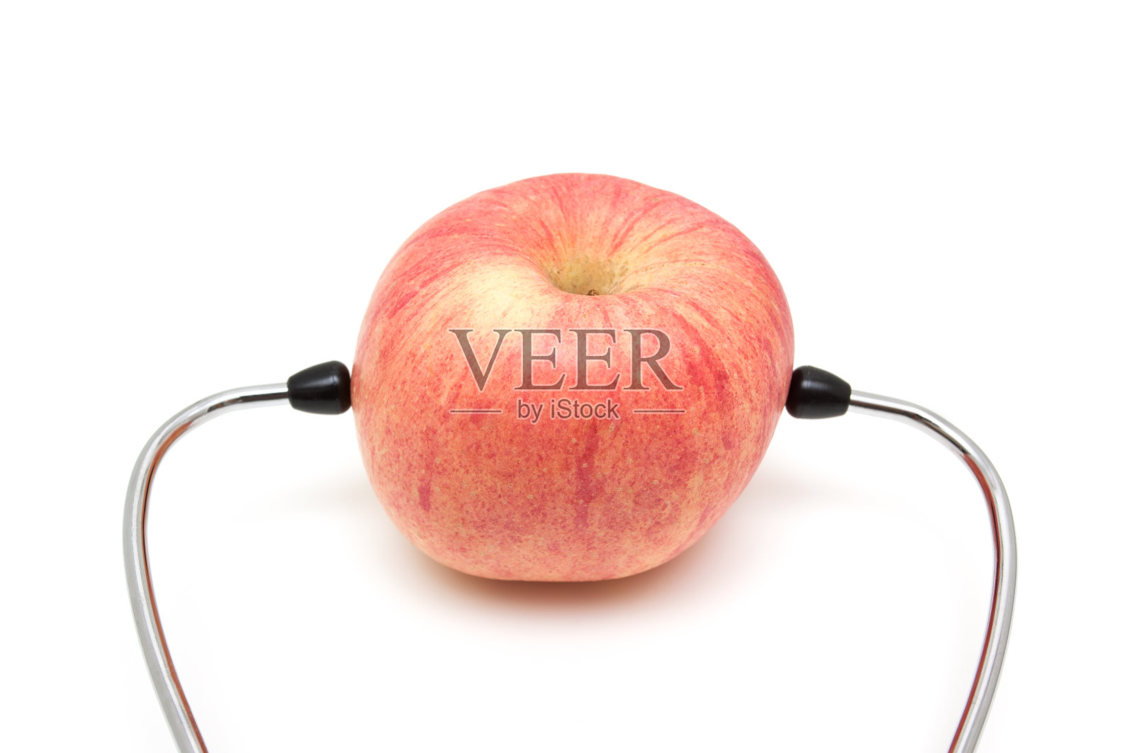 听诊器和苹果(健康饮食)孤立在白色背景上照片摄影图片