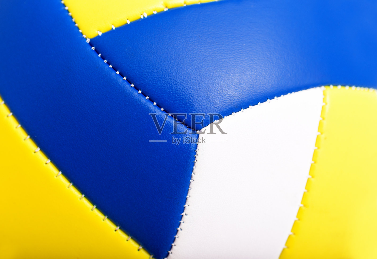 白色，黄色和蓝色的排球照片摄影图片